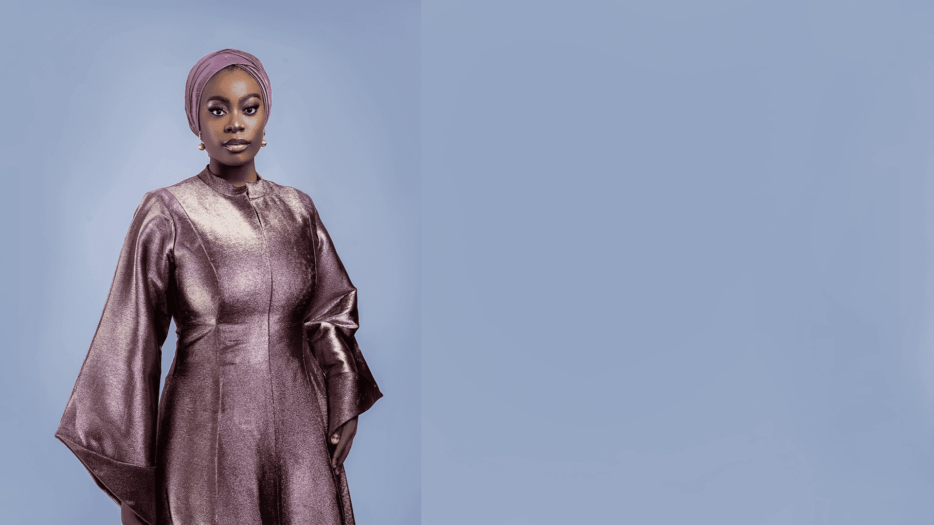 Model in mauve metallic kaftan crafted in our Nigeria atelier